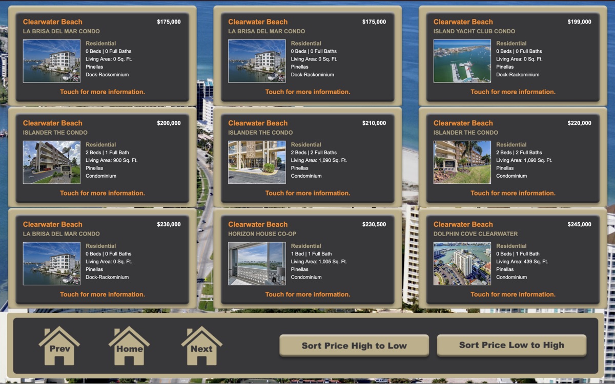 Interactive property search kiosk screen listing Clearwater Beach condos with touch controls